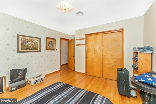 bedroom with a closet and wood-type flooring