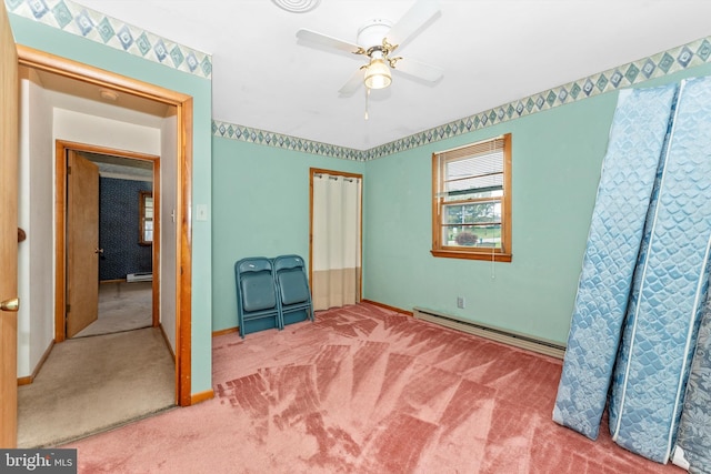 bedroom featuring ceiling fan, carpet floors, and baseboard heating