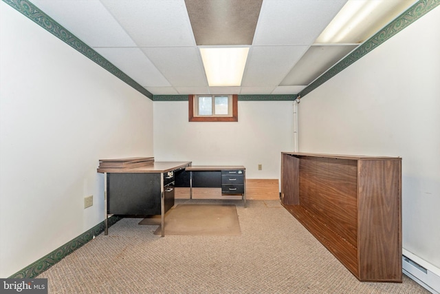 carpeted office featuring a drop ceiling and a baseboard radiator