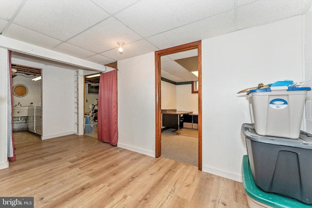 interior space with hardwood / wood-style flooring and a paneled ceiling