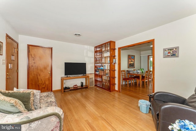 living room with light hardwood / wood-style floors