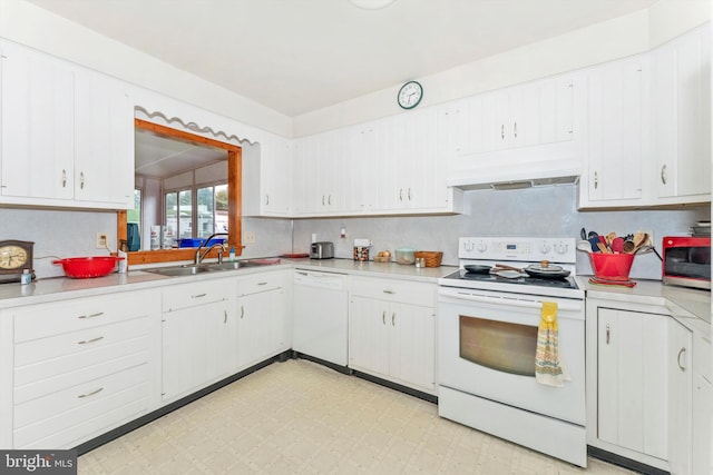 kitchen with decorative backsplash, white appliances, white cabinets, and sink