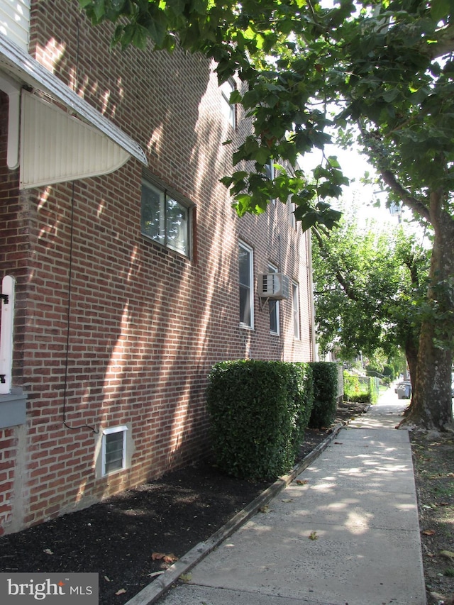 view of property exterior featuring brick siding