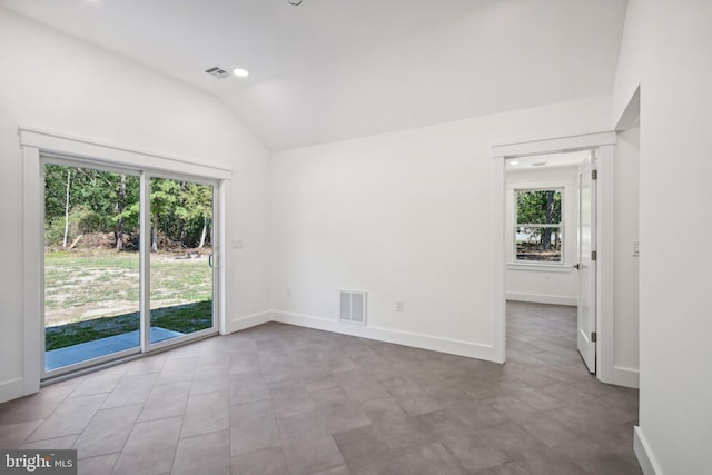 spare room with baseboards, visible vents, vaulted ceiling, and recessed lighting