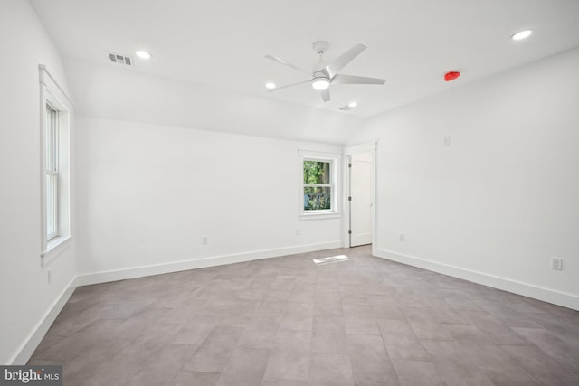 unfurnished room featuring ceiling fan and vaulted ceiling