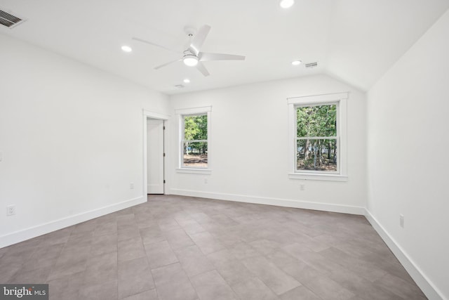 unfurnished room with lofted ceiling and ceiling fan