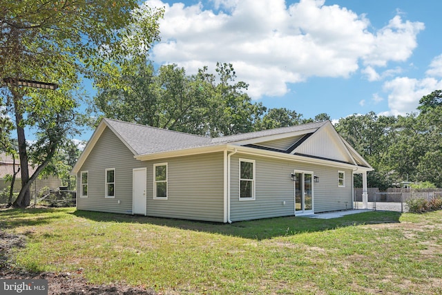 view of home's exterior featuring a lawn and a patio