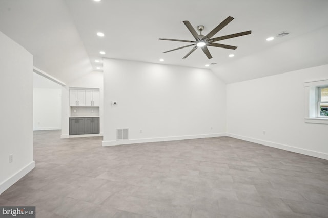 unfurnished living room with visible vents, vaulted ceiling, and recessed lighting