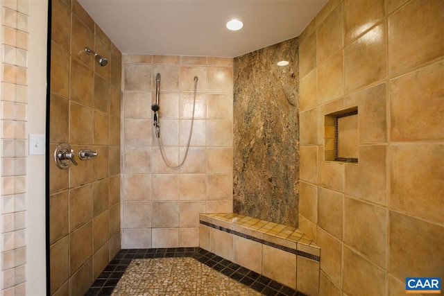 bathroom featuring tiled shower