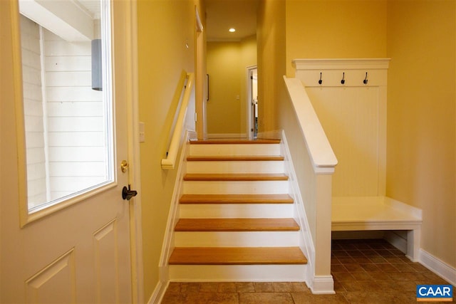 stairway featuring baseboards