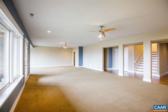 spare room featuring baseboards, visible vents, a ceiling fan, stairway, and recessed lighting