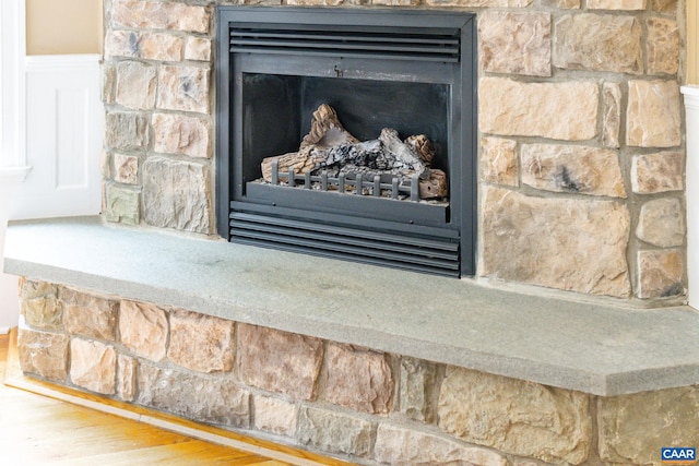 2515 Summit Ridge Trl, Charlottesville, VA 22911 - detailed view of a fireplace, wood finished floors, and a wainscoted wall