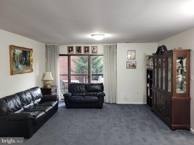 carpeted living room with baseboards and visible vents