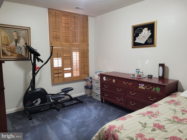 bedroom featuring baseboards, visible vents, and dark carpet