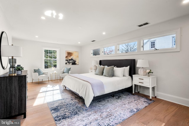 bedroom with light hardwood / wood-style floors