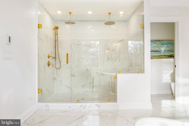 bathroom with a shower with shower door