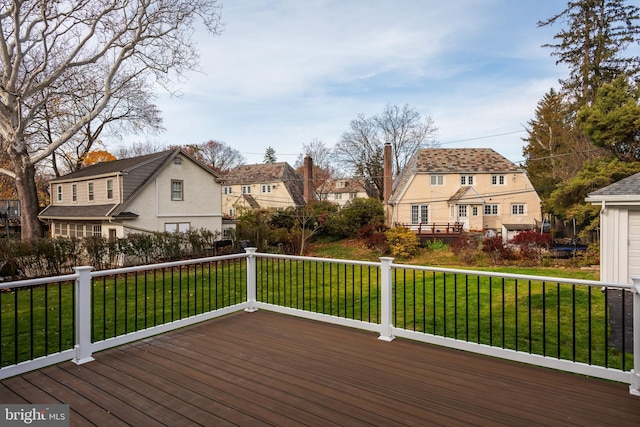 wooden deck with a yard