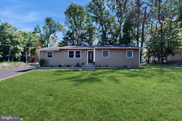 ranch-style house with a front lawn