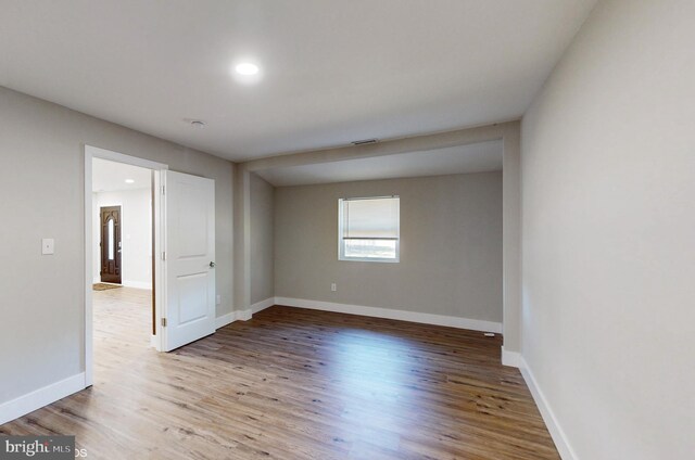 spare room featuring light wood-type flooring