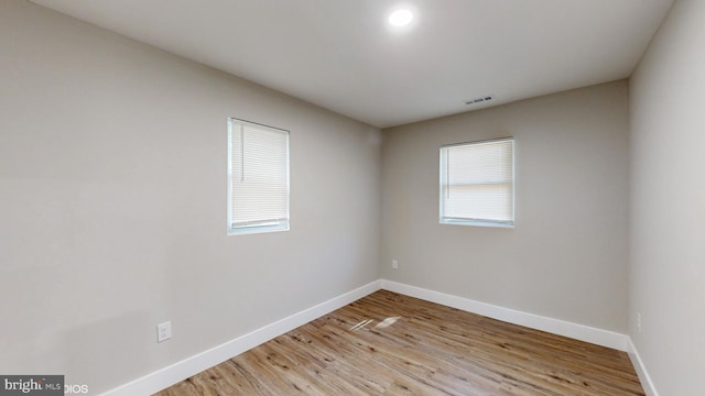 unfurnished room featuring light hardwood / wood-style floors