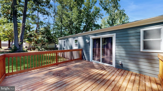 deck featuring a lawn