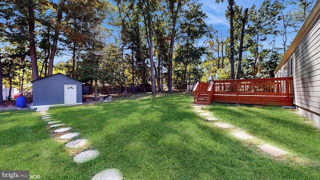 view of yard with a shed and a wooden deck