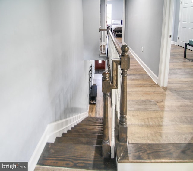 stairway featuring hardwood / wood-style floors