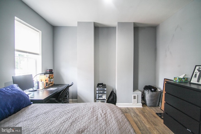 bedroom featuring dark wood-type flooring