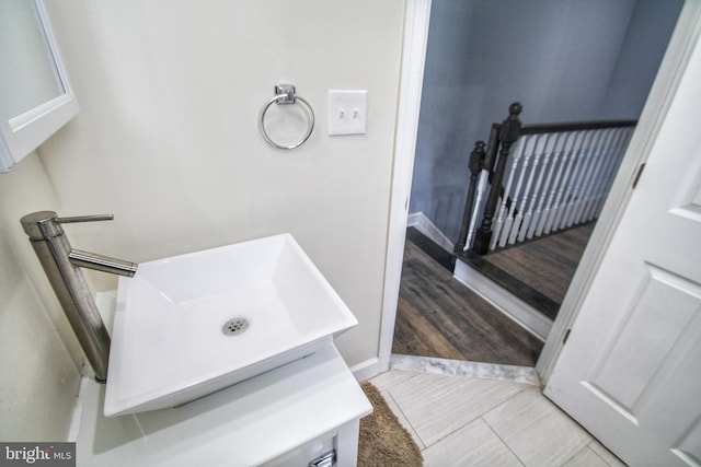 bathroom with vanity and hardwood / wood-style flooring