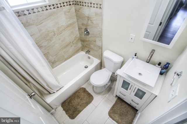 full bathroom featuring vanity, shower / tub combo, toilet, and tile patterned flooring