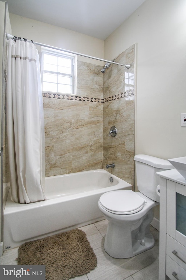 full bathroom with vanity, tile patterned flooring, toilet, and shower / bathtub combination with curtain