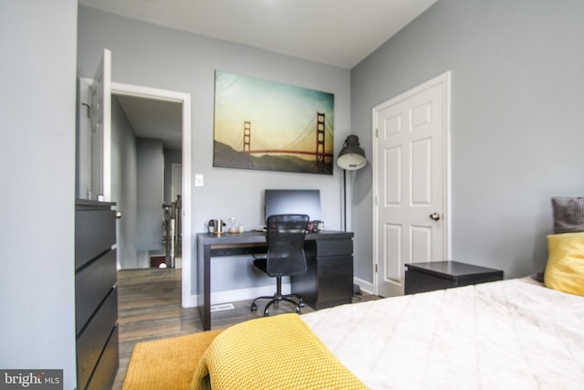 bedroom featuring dark hardwood / wood-style flooring