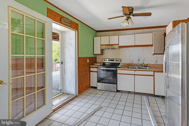 kitchen with sink, white cabinetry, appliances with stainless steel finishes, light tile patterned floors, and ceiling fan