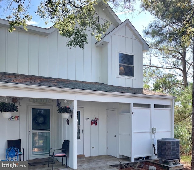 back of house featuring cooling unit