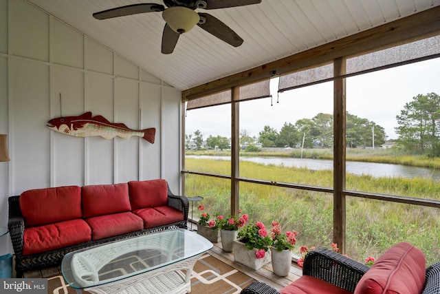 sunroom / solarium with a water view, ceiling fan, vaulted ceiling, and wooden ceiling