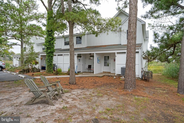 view of front of home featuring covered porch and central air condition unit