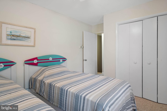 carpeted bedroom featuring a closet