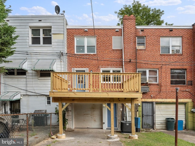 back of house featuring a garage