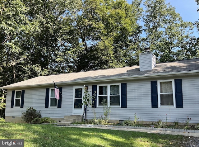 ranch-style home with a front lawn