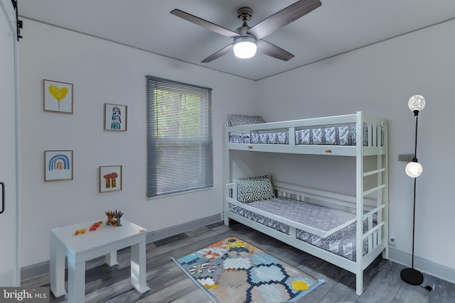 bedroom featuring wood-type flooring and ceiling fan