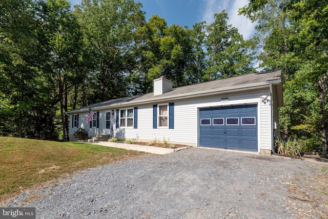 ranch-style home featuring a garage and a front lawn