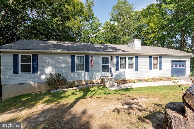 single story home featuring a front yard and a garage