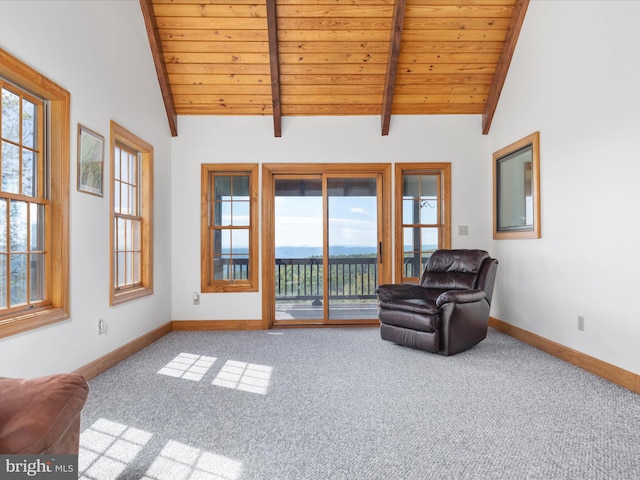 living area featuring beamed ceiling, carpet flooring, high vaulted ceiling, and wooden ceiling