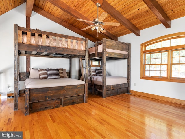 bedroom featuring wood ceiling, vaulted ceiling with beams, and light hardwood / wood-style floors