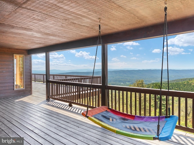 wooden deck with a mountain view