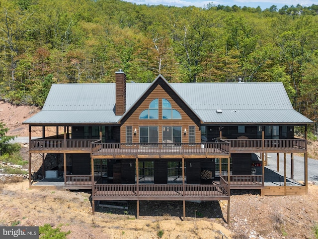 rear view of house with a deck