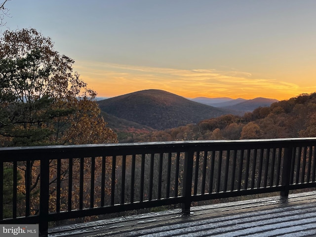 deck at dusk with a mountain view