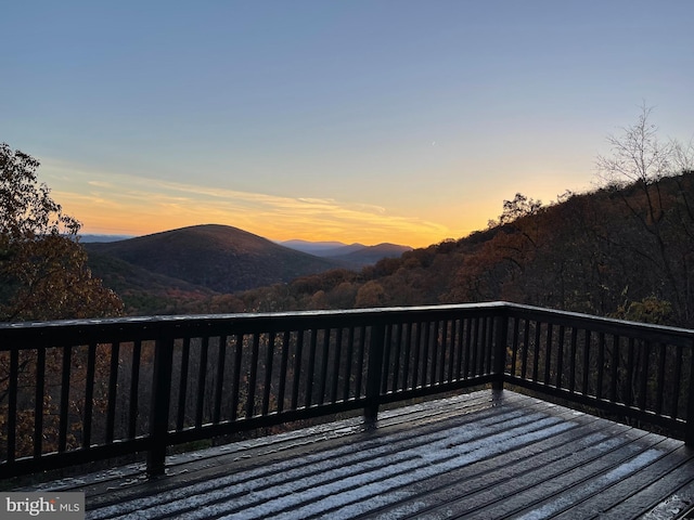 deck at dusk with a mountain view