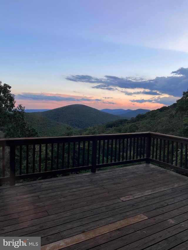 deck at dusk with a mountain view