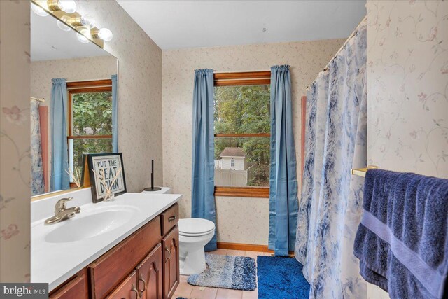 8 Annapolis Dr, Sicklerville, NJ 08081 - bathroom featuring a wealth of natural light, tile patterned flooring, vanity, and wallpapered walls